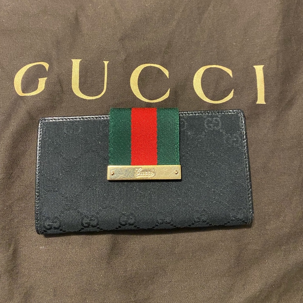 Gucci Black GG Canvas and leather Continental wallet.